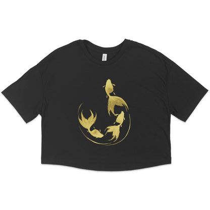 Women's black crop top t-shirt with gold colored graphic design of 3 goldfish in a semi-circular shape done in sumi-e painting style against a white background